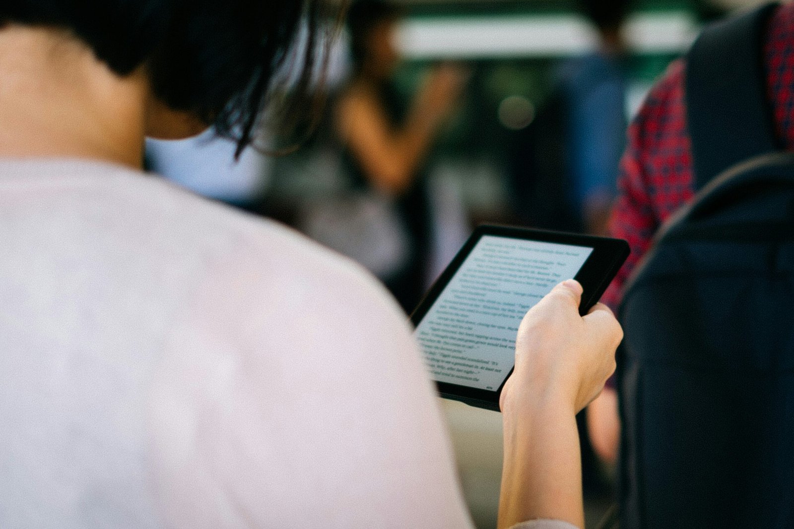 woman holding ebook reader